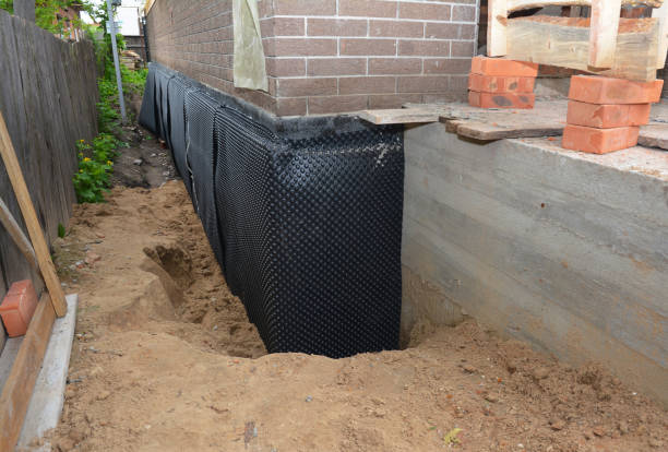 SJ Waterproofing Pros technician performing targeted Wet Basement Repair assessment in Gettysburg, PA